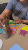 A woman painting at a craft party by Brown Glitter