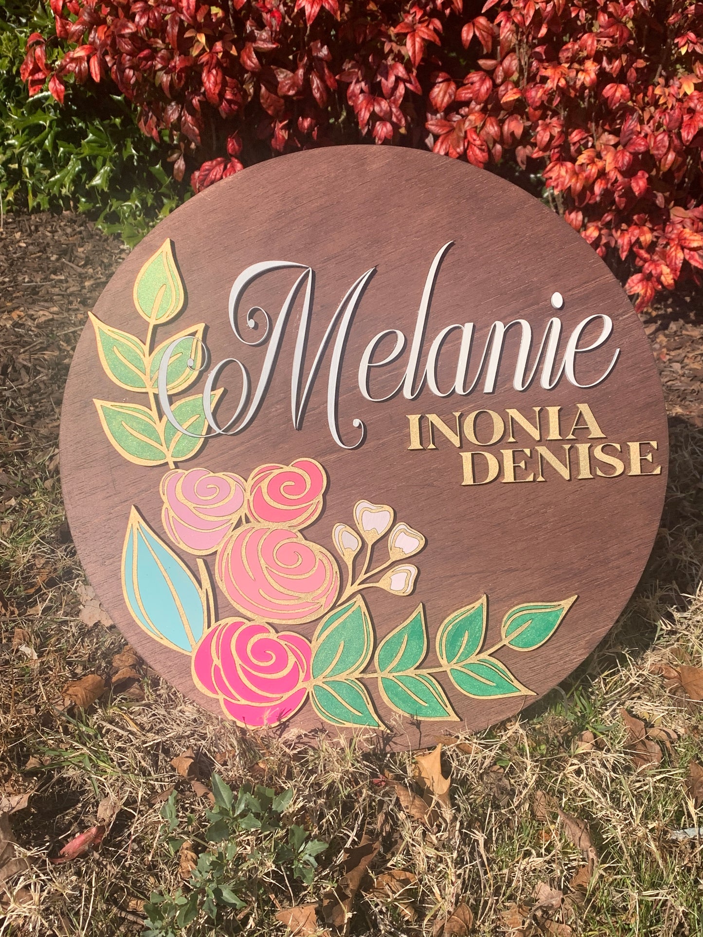 Custom circular wood wall art designed with name and flowers